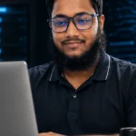 Passware review 2026 featured image showing a focused digital-forensics analyst working at a decryption dashboard on a workstation in a dark high-tech lab