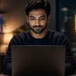 NordVPN vs hide.me 2026: Which VPN Wins NordVPN vs hide.me VPN comparison, shown as a blue NordVPN shield and a yellow hide.me shield beside a man working at a laptop in an evening home office.