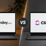 monday.com Alternatives Without a Seat Minimum: 4 Tools That Bill Per Person Two open laptops facing each other on a desk split into warm and cool halves, the left screen showing the monday.com logo and the right screen showing the ClickUp logo, separated by a VS badge.
